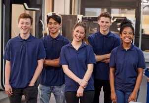 Portrait Of Engineering Apprentices In Factory